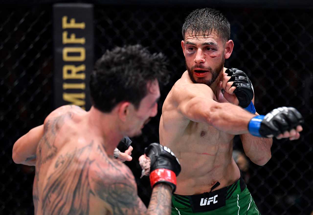 After 'one the greatest fights ever,' Max Holloway and Yair Rod pose for photos in AMBULANCE.