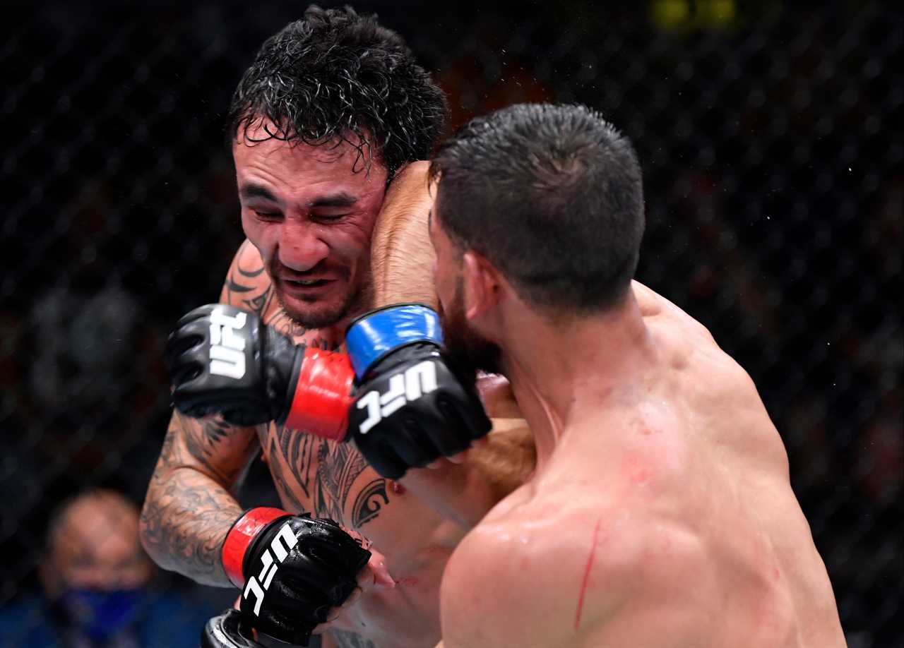 After 'one the greatest fights ever,' Max Holloway and Yair Rod pose for photos in AMBULANCE.