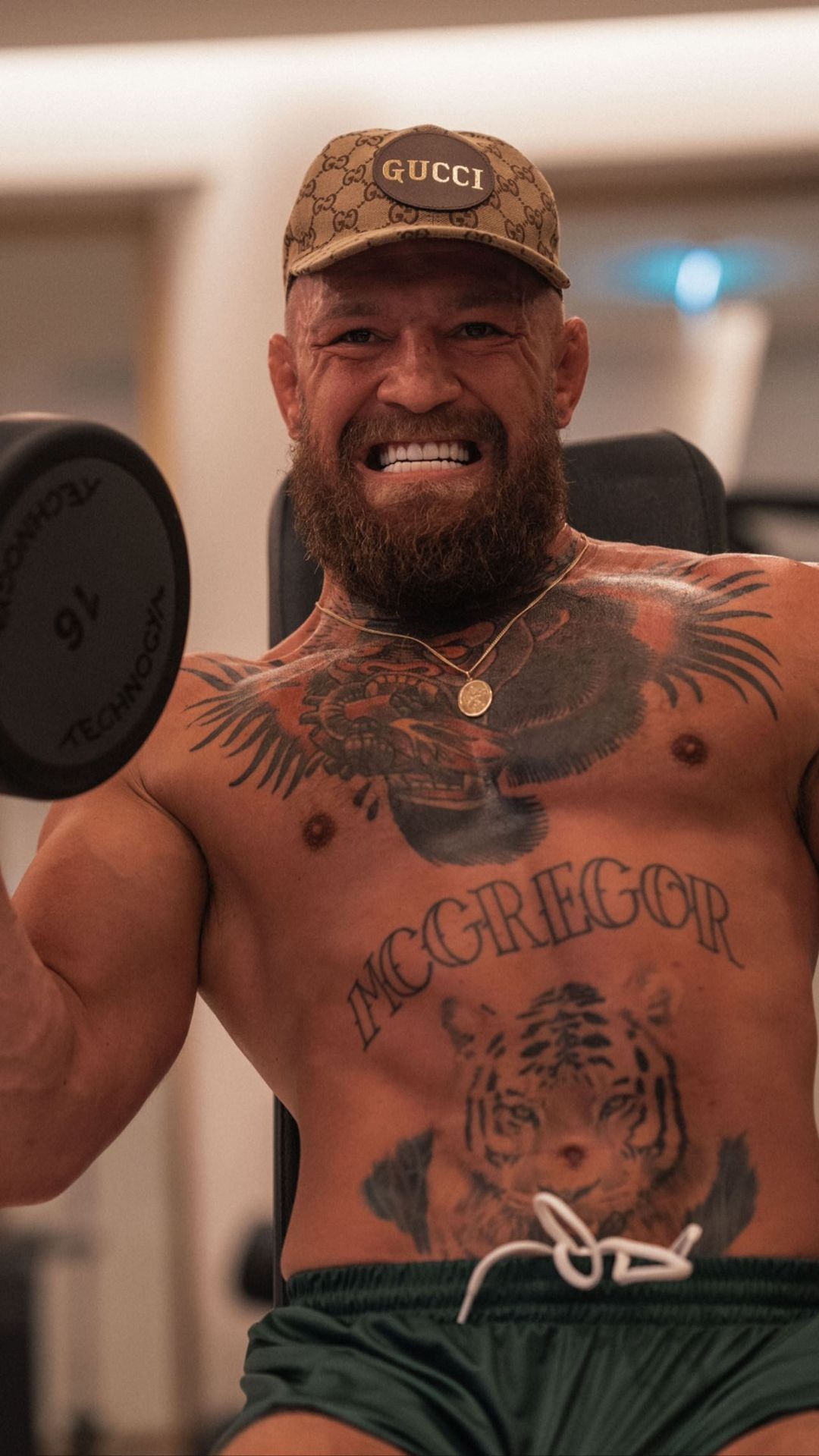 Conor McGregor's jacked frame is shown in pic with his fiancee. His coach says he will start training in a few weeks.