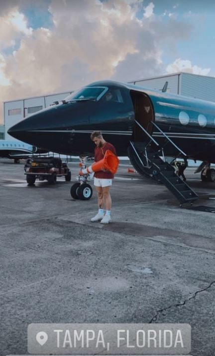 Jake Paul dancing in the rain to Olivia Rodrigo, in his only pants, before boarding a private jet for Tyron woodley fight