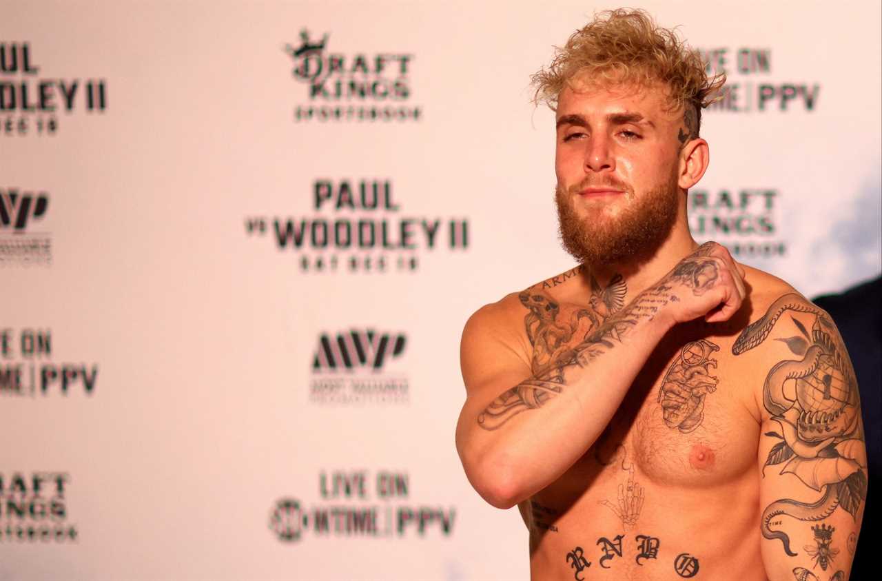 Jake Paul makes a throat-slitting gesture at Tyron Woodley's weigh-in and is heavier than the first fight