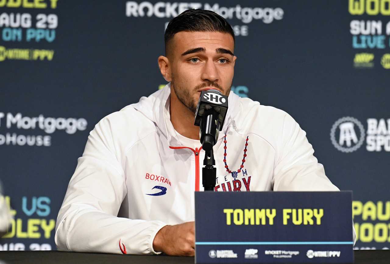 Jake Paul rocks a 'this could't have been you' Tshirt at Tommy Fury. YouTuber Tyron Woodley is next to Jake Paul