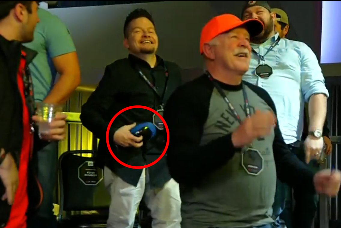 MMA fan keeps Derrick Lewis' sweaty CUP in his hand after he throws it into the crowd. Viewers say they would do the same.