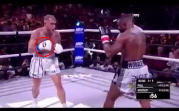 Tyron Woodley and Jake Paul are accused of fixing fight after a'secret hand signal was spotted just moments before KO