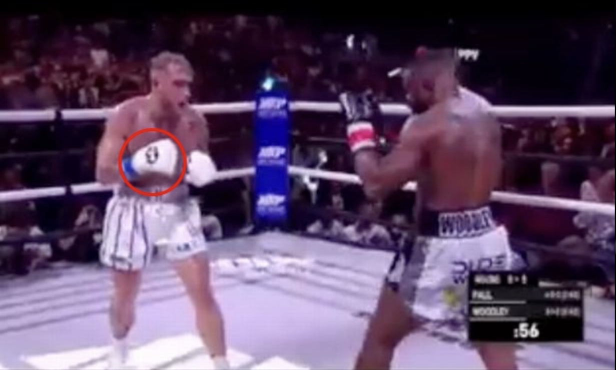 Tyron Woodley's coach quashed Jake Paul's claims that Jake Paul was trying to fix the fight after fans believed they had seen secret hand signals before KO