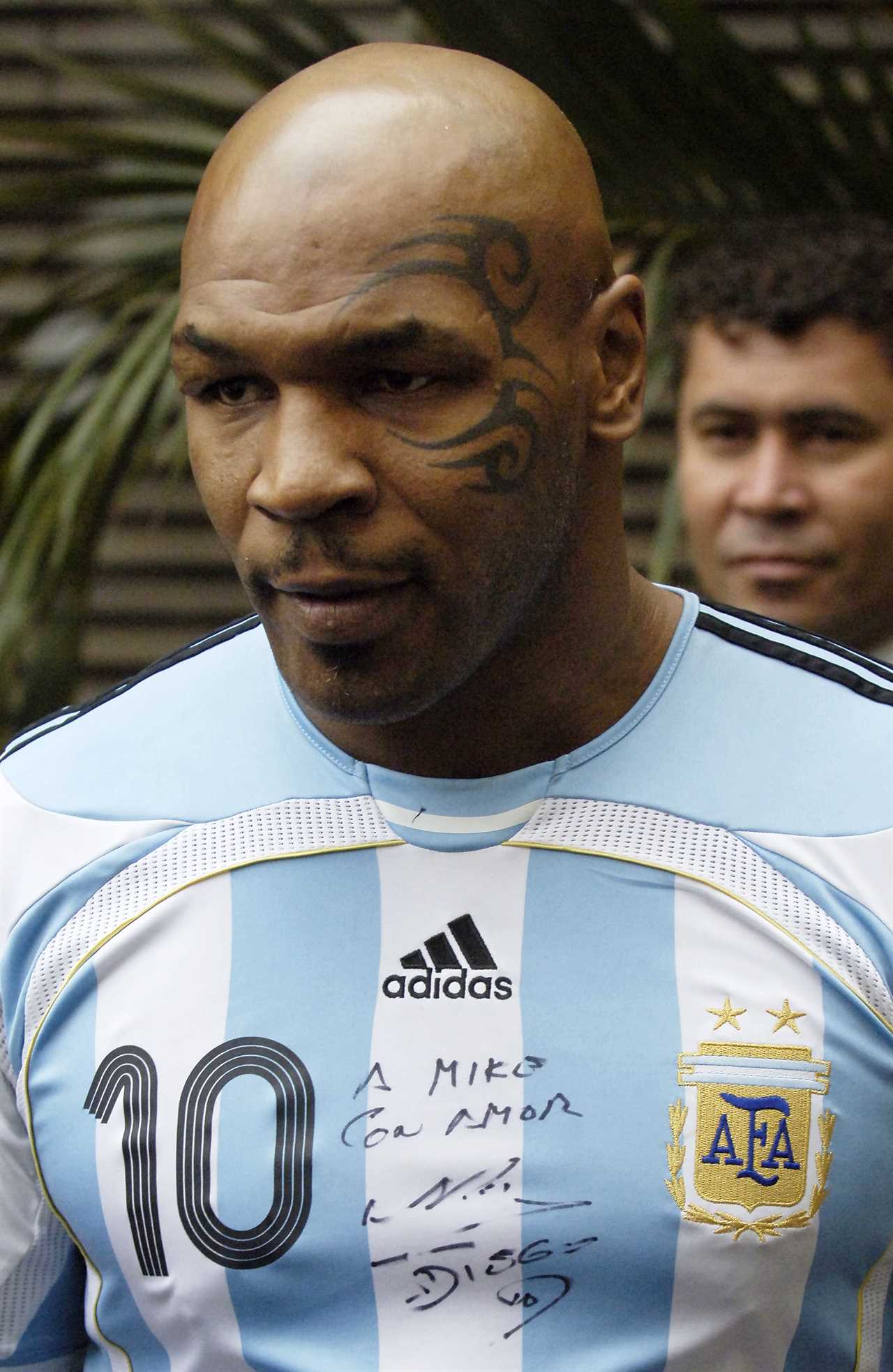 After 'assaulting a cameraman', Mike Tyson made fun of Brazil by wearing a Maradona-signed Argentina shirt to court.