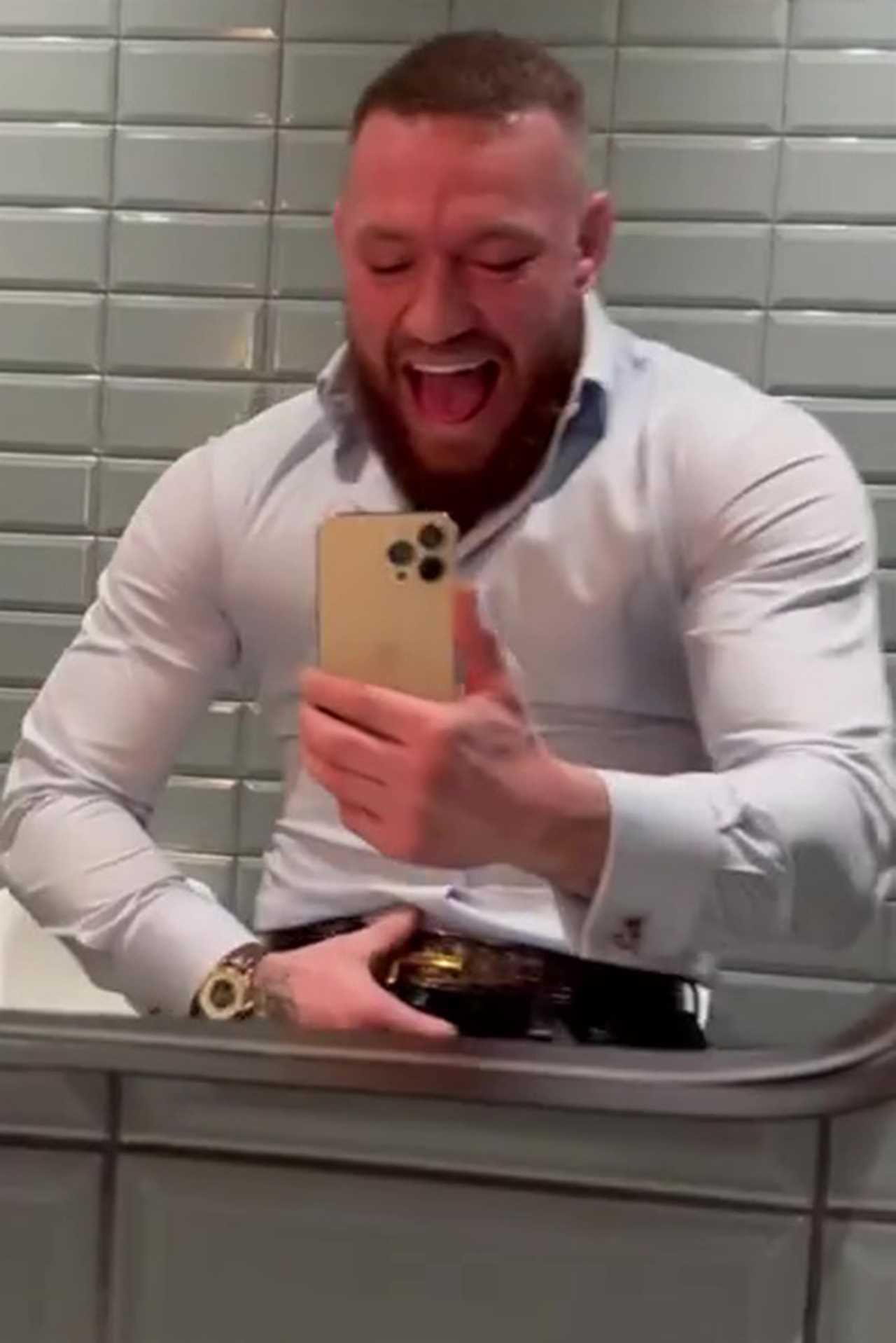 Conor McGregor shouts as he flexes in the mirror after a night out.