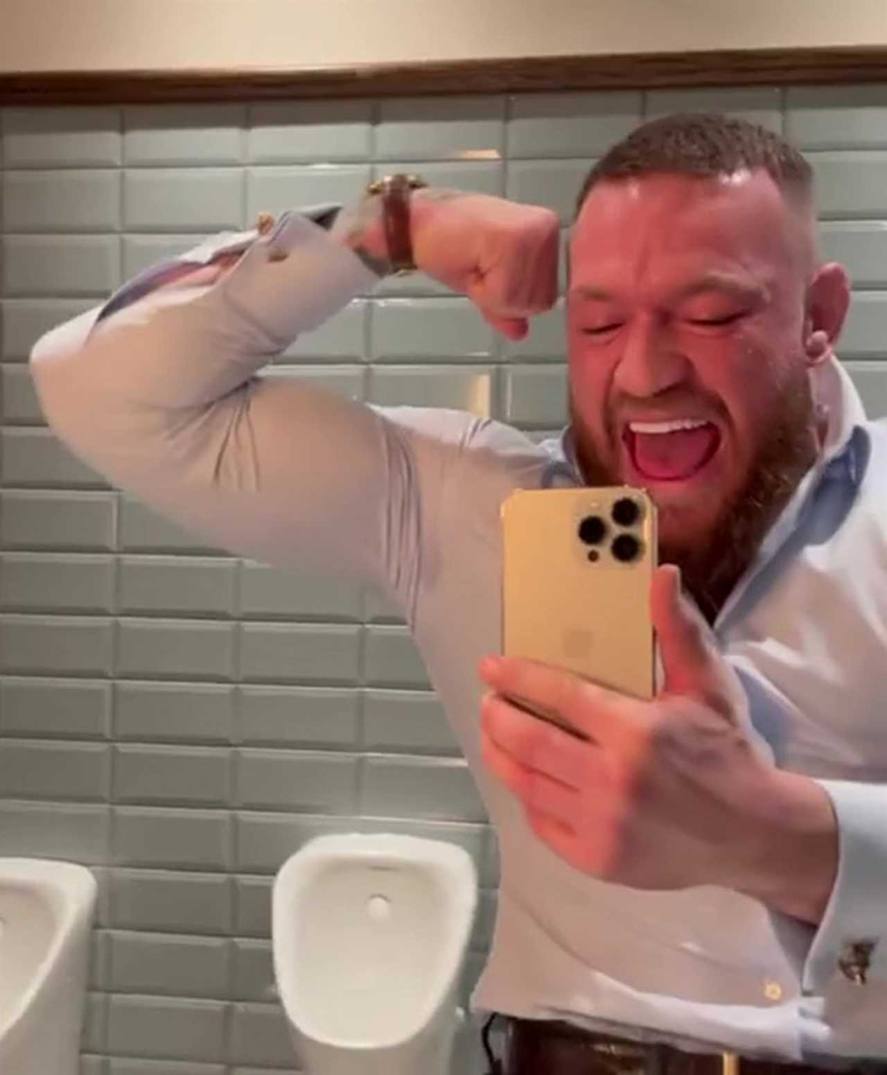 Conor McGregor shouts as he flexes in the mirror after a night out.