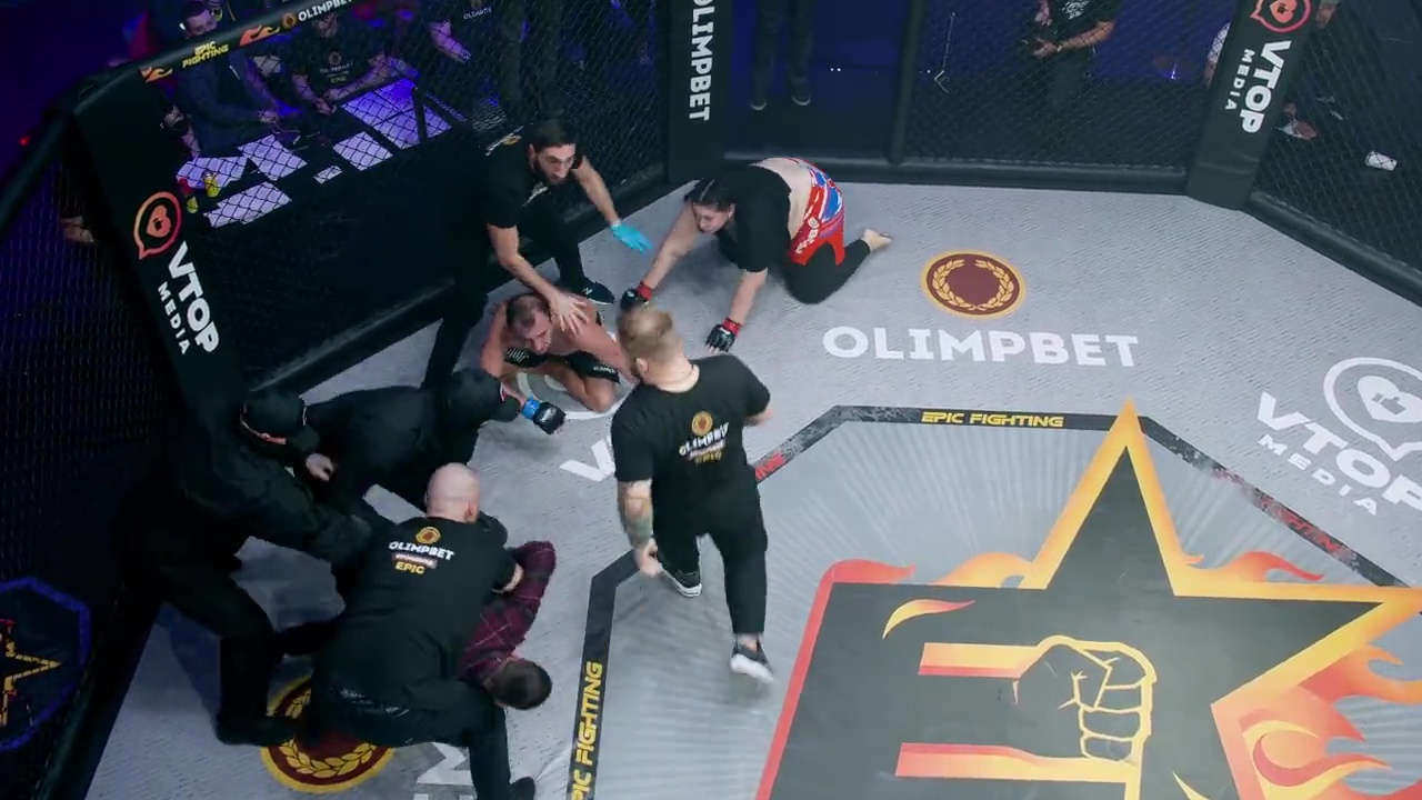 Shocking moment: Male porn star fights female blogger at MMA, before fan leaps in cage in attempt to break up mixed-gender bout