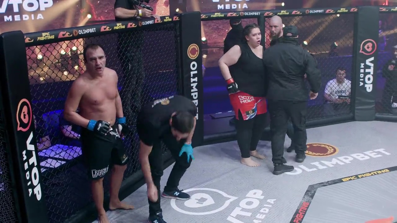 Shocking moment: Male porn star fights female blogger at MMA, before fan leaps in cage in attempt to break up mixed-gender bout