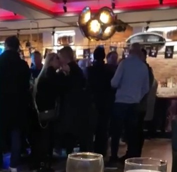 After watching Man City's draw against Southampton, Ricky Hatton, a boxing legend, snogs a mystery woman in a pub