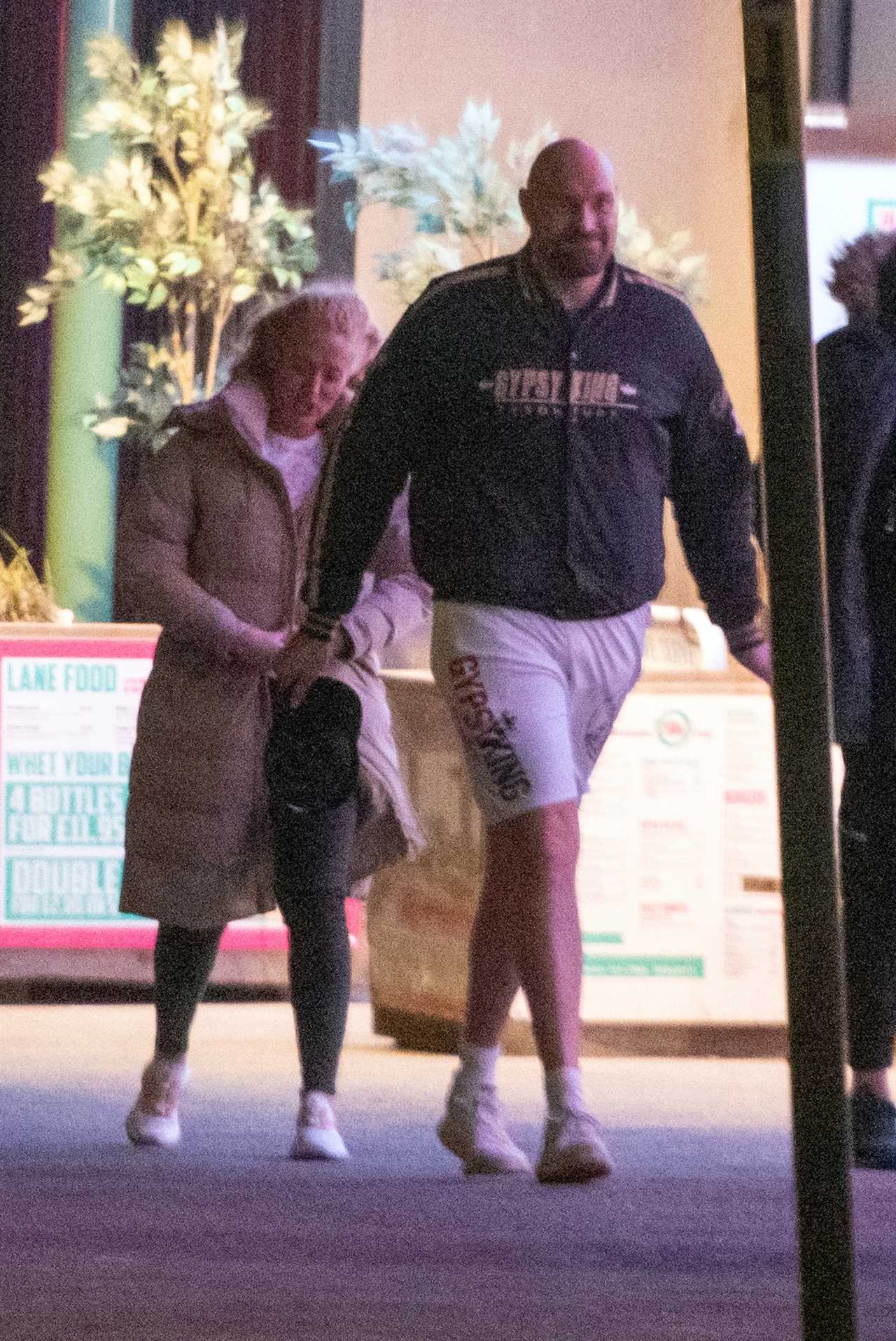 Tyson Fury braves the freezing cold in Gypsy King SHORTS while he enjoys a night at Morecambe Bowling Alley with his wife Paris
