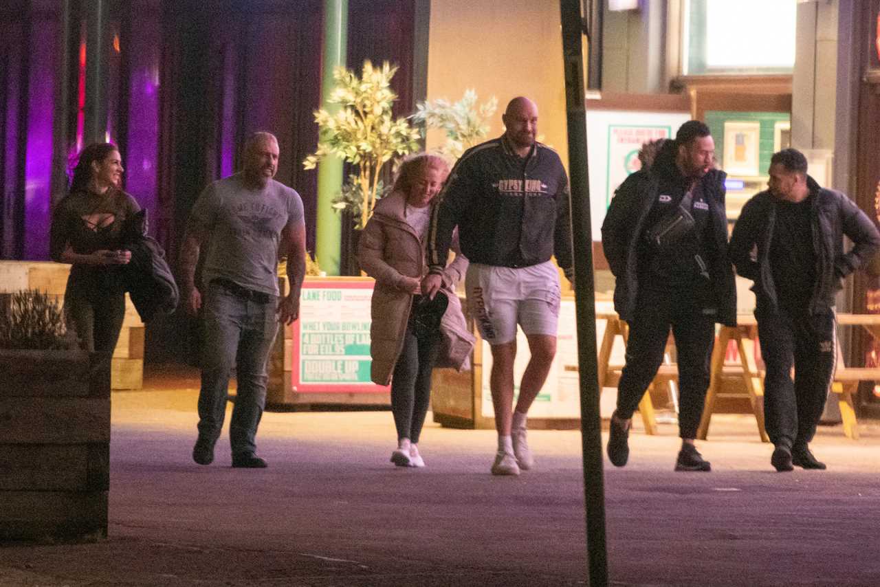 Tyson Fury braves the freezing cold in Gypsy King SHORTS while he enjoys a night at Morecambe Bowling Alley with his wife Paris