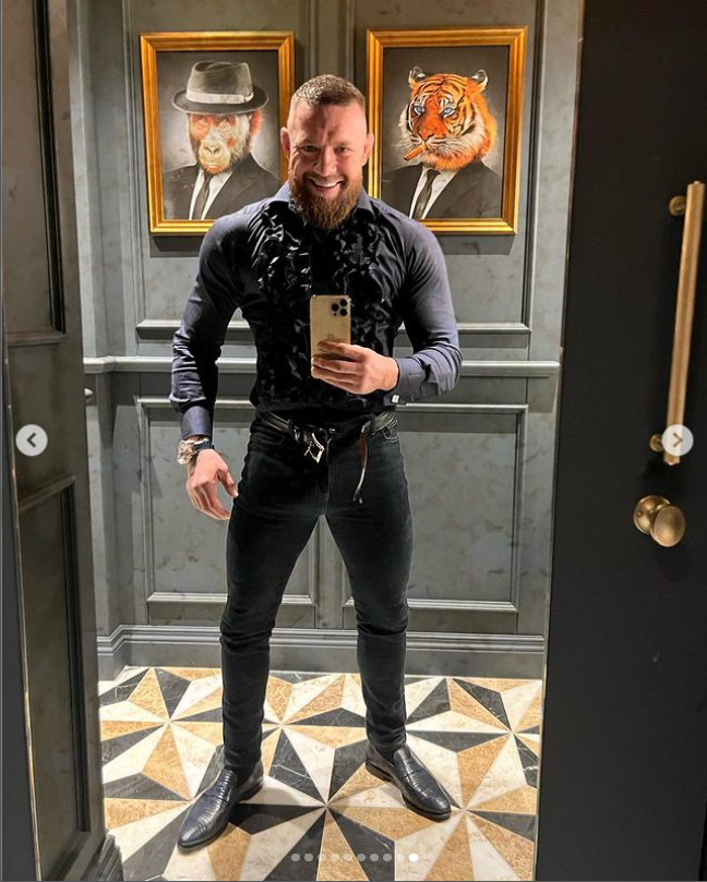McGregor posed with his belt unbuckled