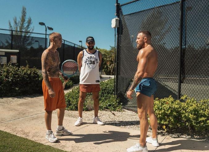 ‘Two goats chopping it up’ – UFC star Conor McGregor bumps into Justin Bieber in the Bahamas at tennis court