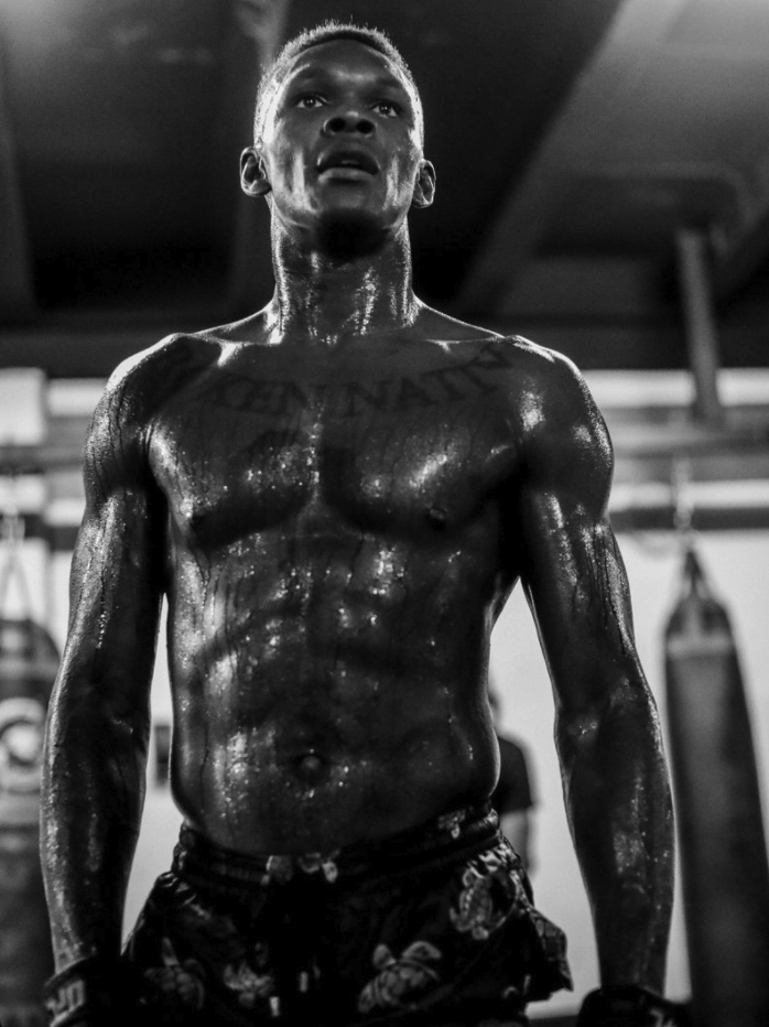 UFC champ Israel Adesanya displays a ripped physique and labels himself'manimal’ ahead of Robert Whittaker's rematch