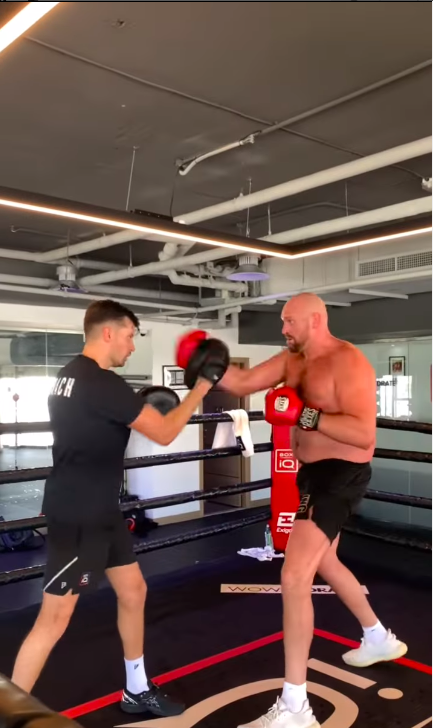 Topless Tyson Fury shows off his speed on pads, as he claims that he can beat DillianWhyte with one hand behind mine.