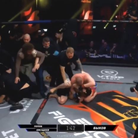 After two controversial fights, masked men climb into MMA cages to start a mass brawl