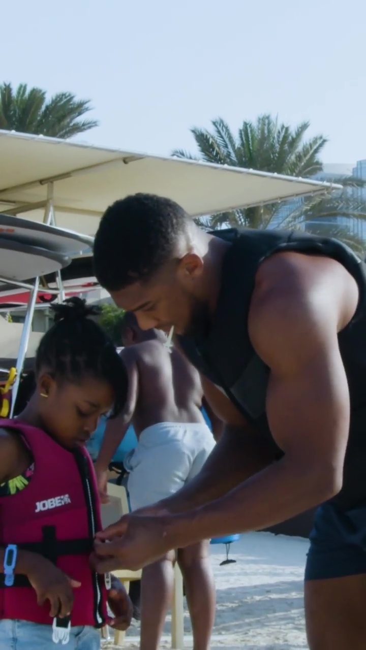 Anthony Joshua is the fun uncle as he and his family indulge in watersports during a day before Usyk rematch