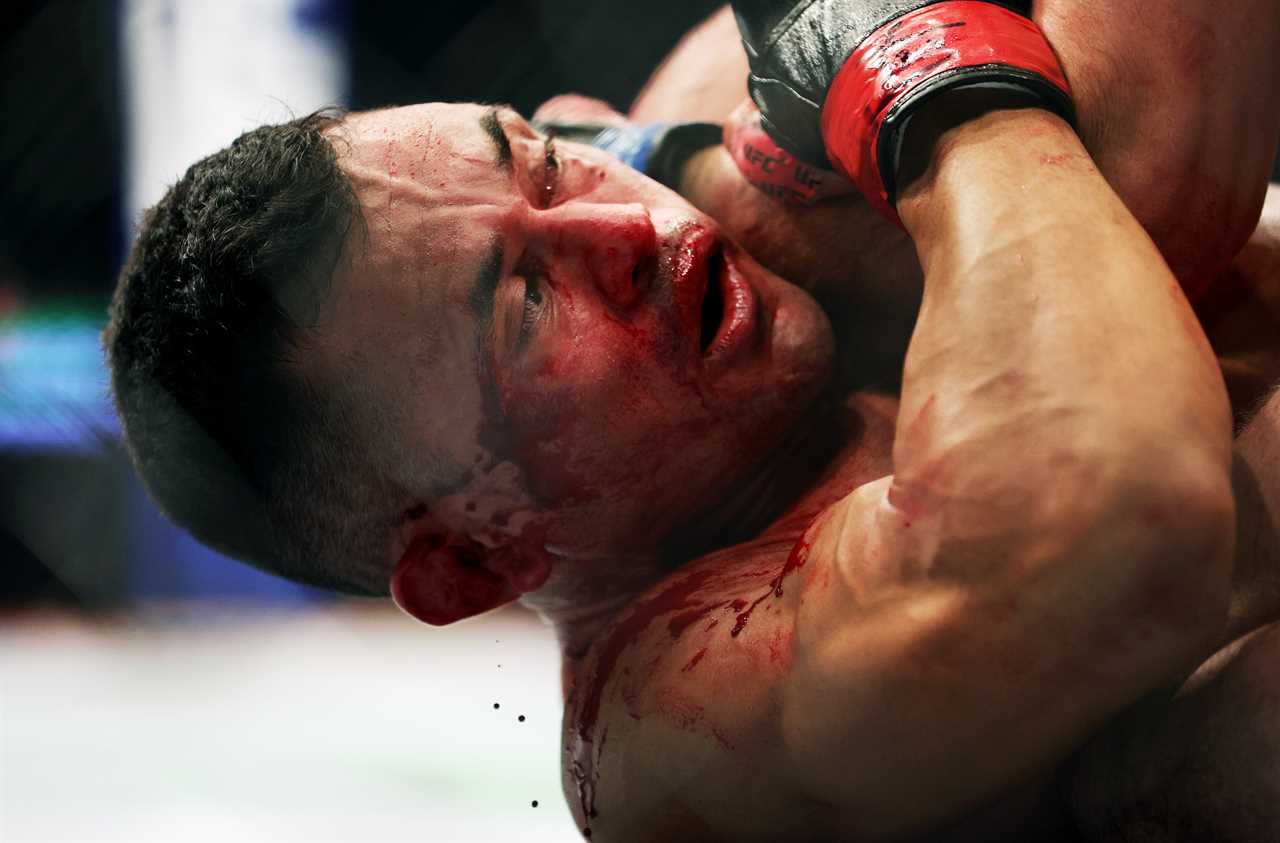 UFC 271: Watch Bloodied Douglas Silva de Andrade choke Sergey Morozov UNCONSCIOUS, after he suffered a HORRIFIC cut