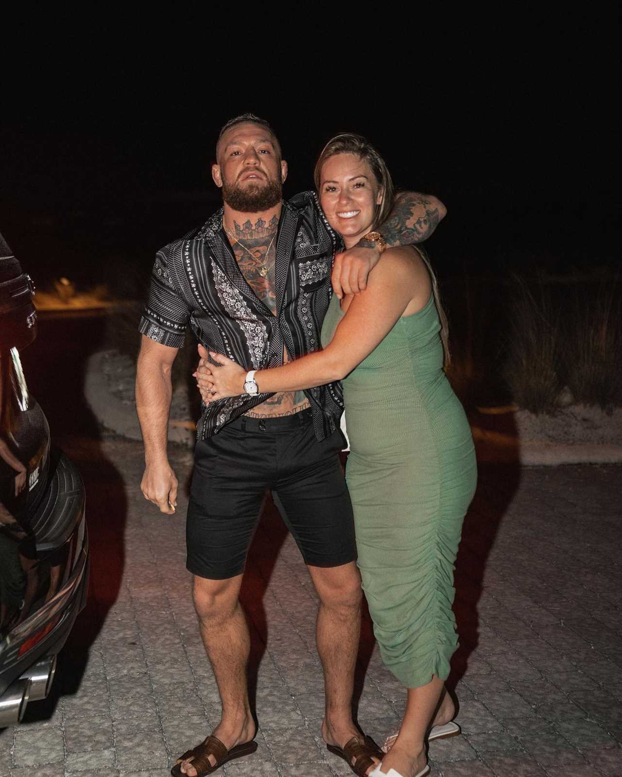 Conor McGregor smothers Dee Devlin during their 'Valentine's Day Workout', before they go on a cheesy movie date with snacks