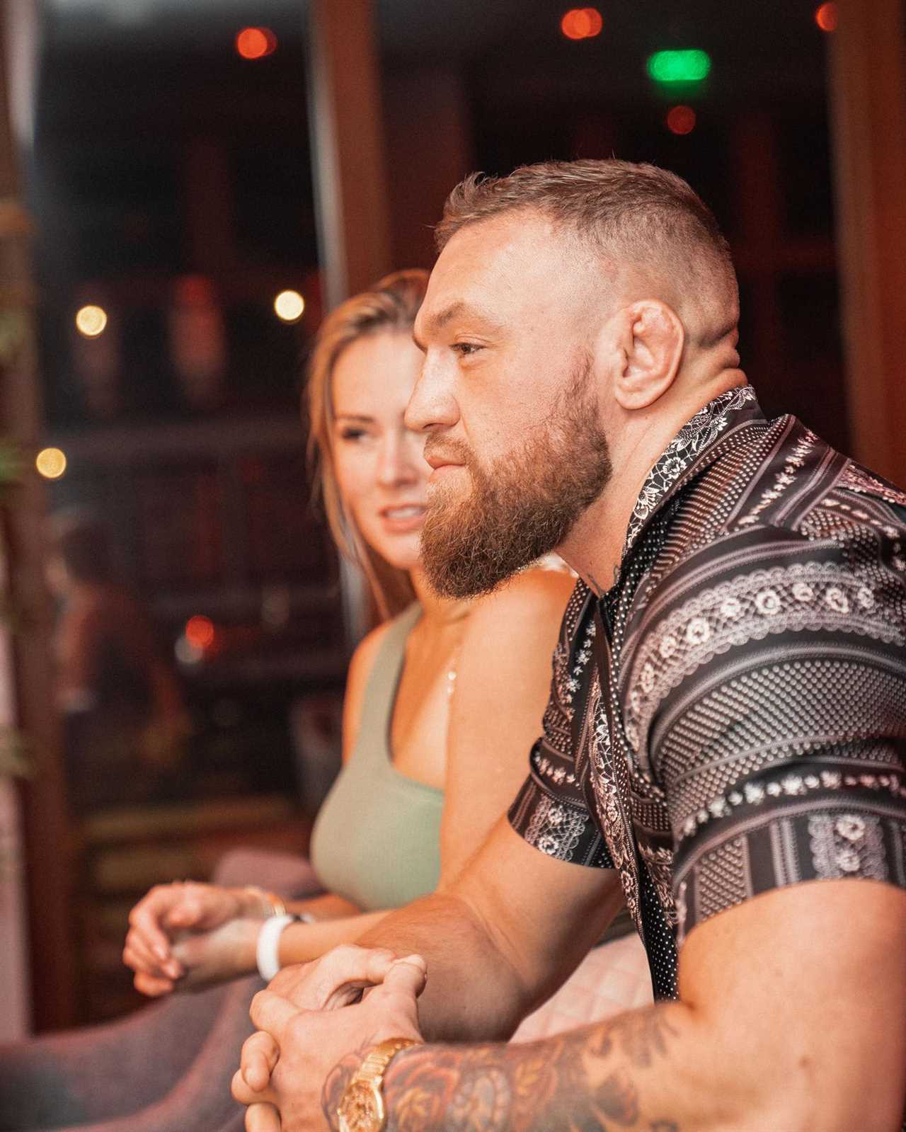 Conor McGregor smothers Dee Devlin during their 'Valentine's Day Workout', before they go on a cheesy movie date with snacks