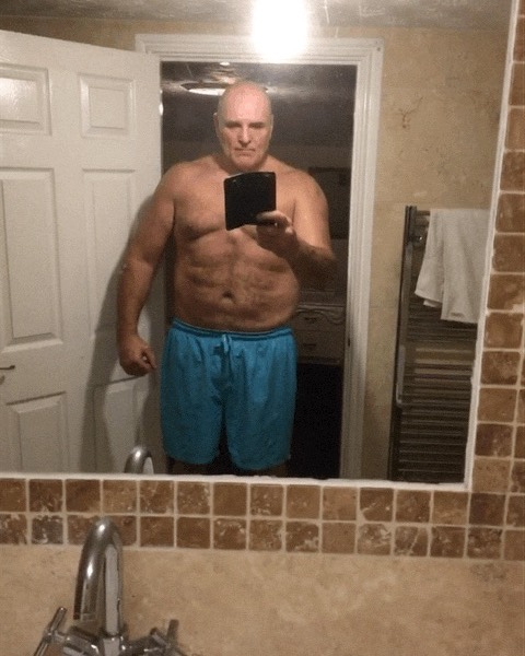 John Fury, 57 shows off his bulky abs in a bathroom selfie after training alongside Tyson, ahead of the fight against Dillian Whyte