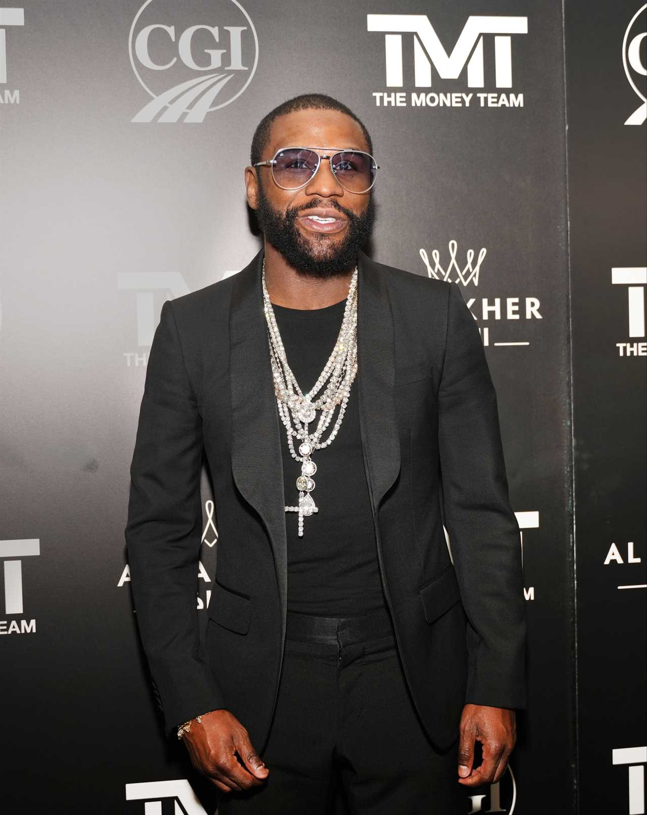 Floyd Mayweather celebrates his birthday with bikini-clad women carrying giant boxes of the billionaire boxing business empire.