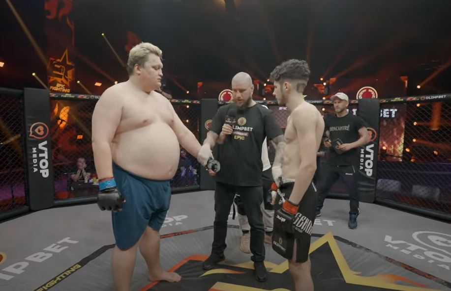 In a bizarre Russian MMA fight, watch as a 27stone fighter gets sucked by a rival one-third of his weight.