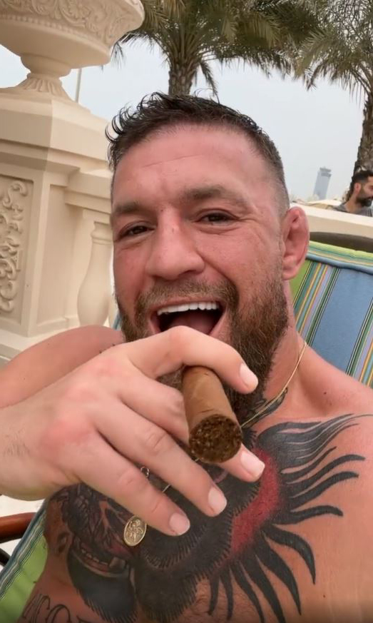 Conor McGregor's bizarre, three-second clip in which he laughs topless while smoking an unlit cigar is a puzzlement for fans
