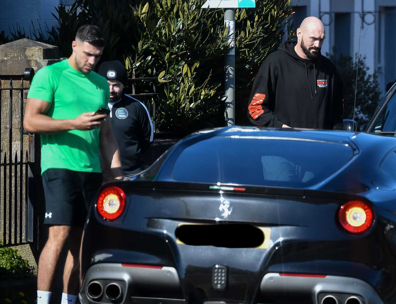 Tyson Fury, 6'9in tall, struggles to get in the supercar before Whyte fight