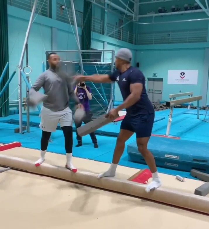 After knocking his team-mate off the balance beam, Anthony Joshua nails Cristiano Ronaldo's Siu celebration.