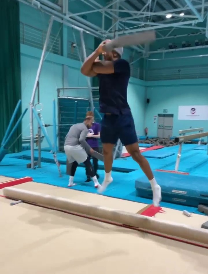 After knocking his team-mate off the balance beam, Anthony Joshua nails Cristiano Ronaldo's Siu celebration.
