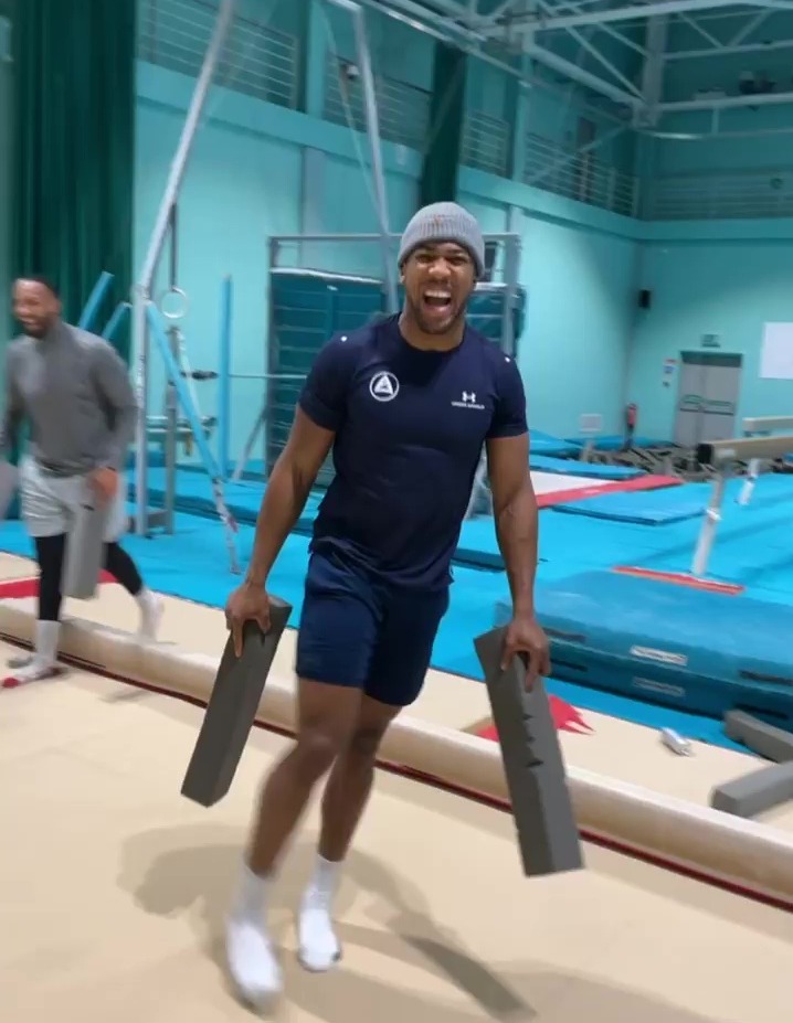 After knocking his team-mate off the balance beam, Anthony Joshua nails Cristiano Ronaldo's Siu celebration.