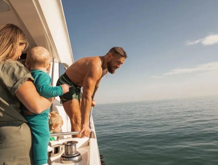 Conor McGregor enjoys a family-friendly boat trip, just days after UFC star was stopped by police in his Bentley