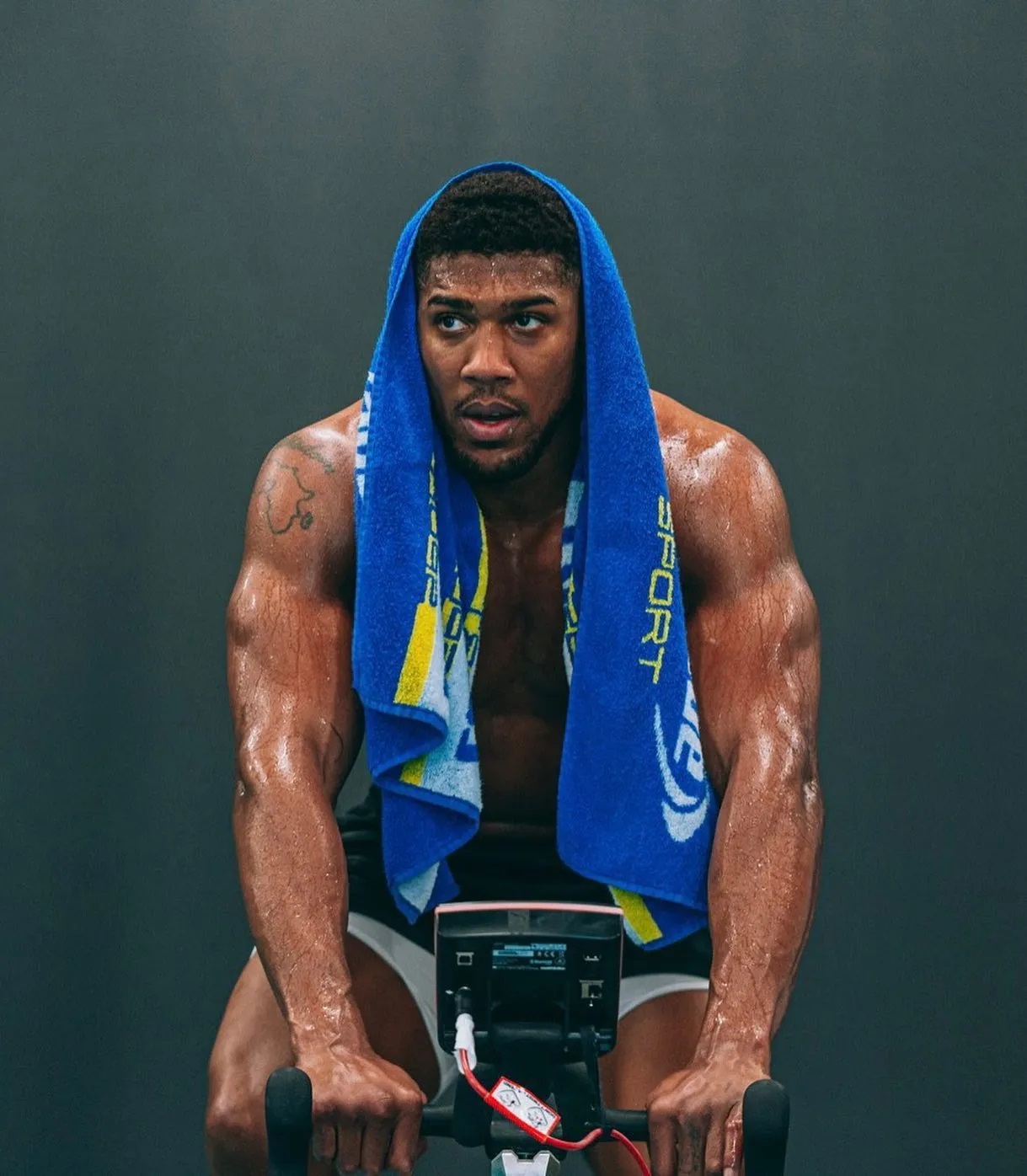 Anthony Joshua was slammed for his'staged photo shoot', and'spraying on himself' by Chael Sonnen, a former UFC fighter.