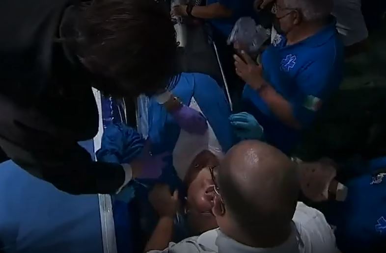 After being knocked out by a brutal punch from a fighter, he is taken to the ring.