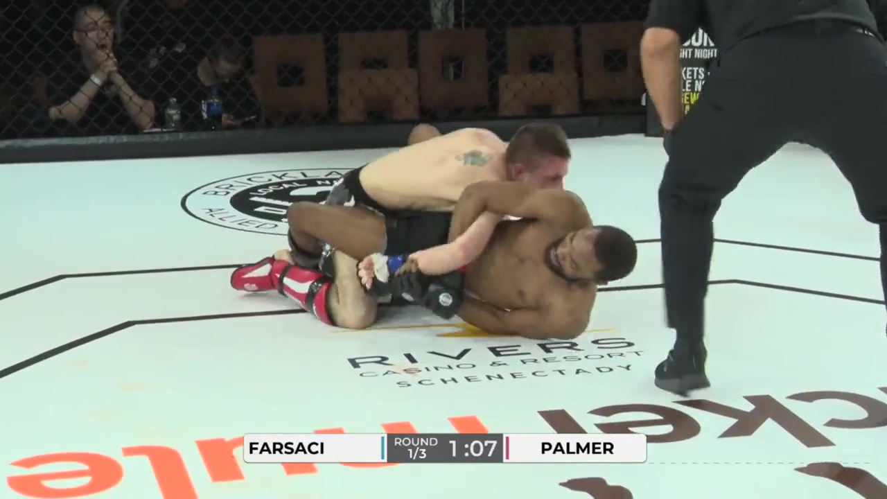 Farsaci, a MMA fighter, has his shoulder ripped out of socket. He writhes in pain after refusing tap out.