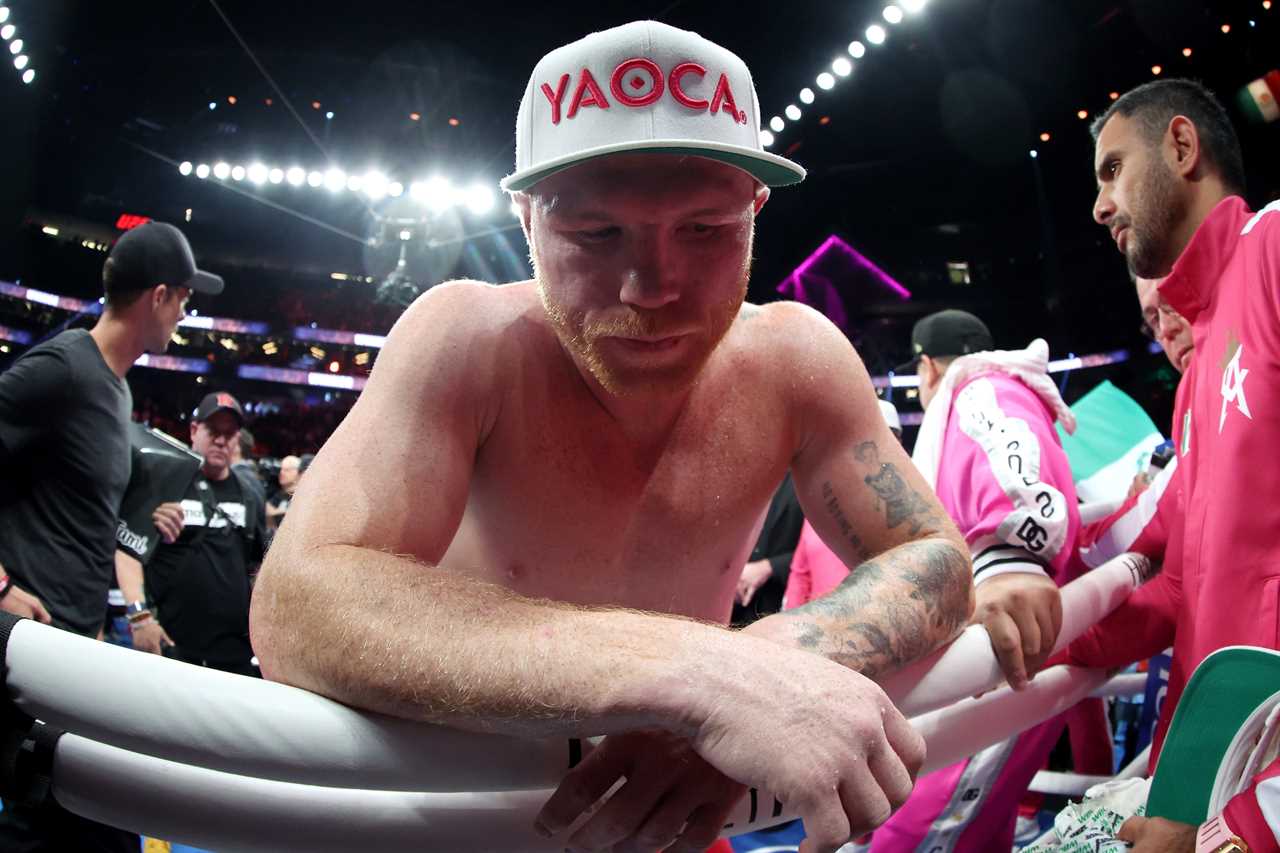 Mike Tyson and Lakiha Tyson smile as they sit ringside to watch Canelo Alvarez lose to Bivol in Las Vegas