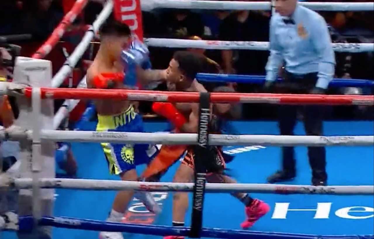 Boxer was sent crashing through ropes by a photographer who forced him to hold his neck.
