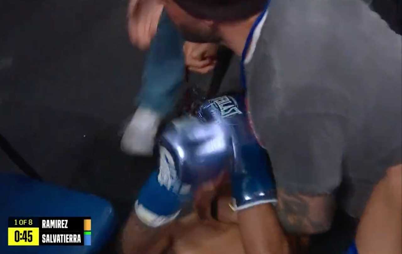 Boxer was sent crashing through ropes by a photographer who forced him to hold his neck.