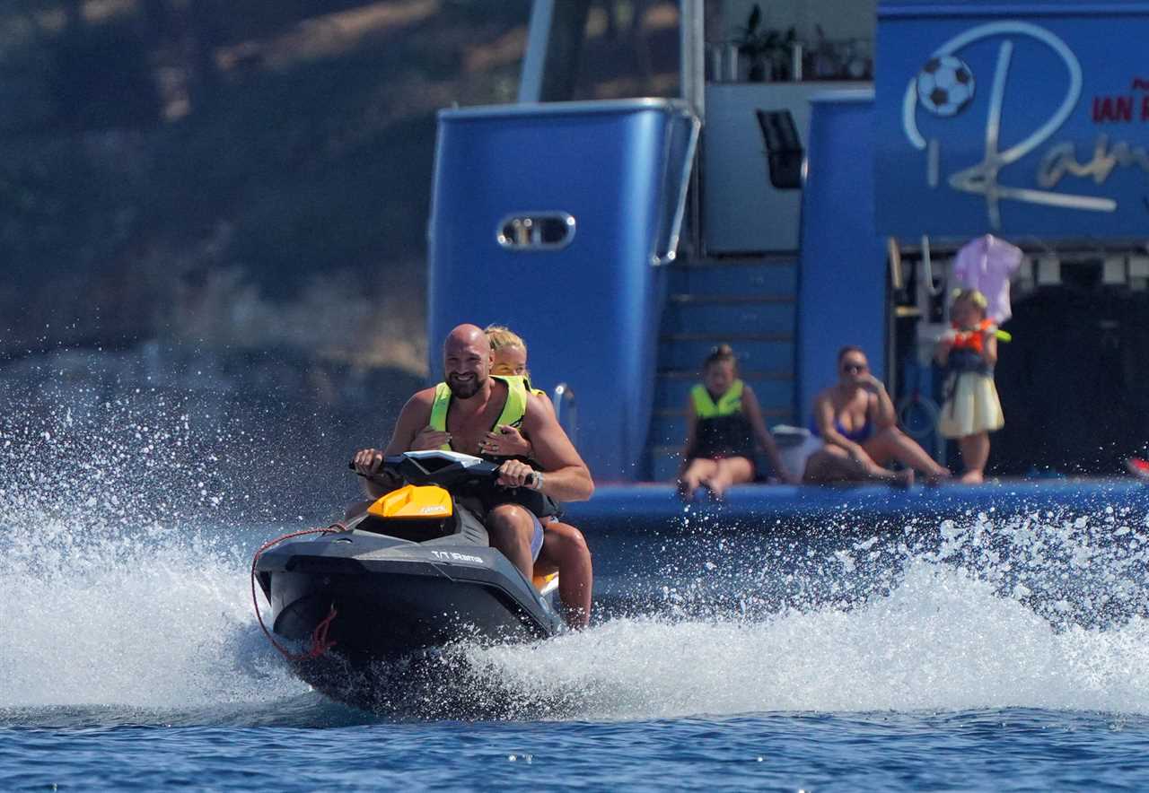 Tyson Fury and his wife Paris cruise the waves in jet skis while boxing champ enjoys a luxury vacation aboard superyacht Cannes