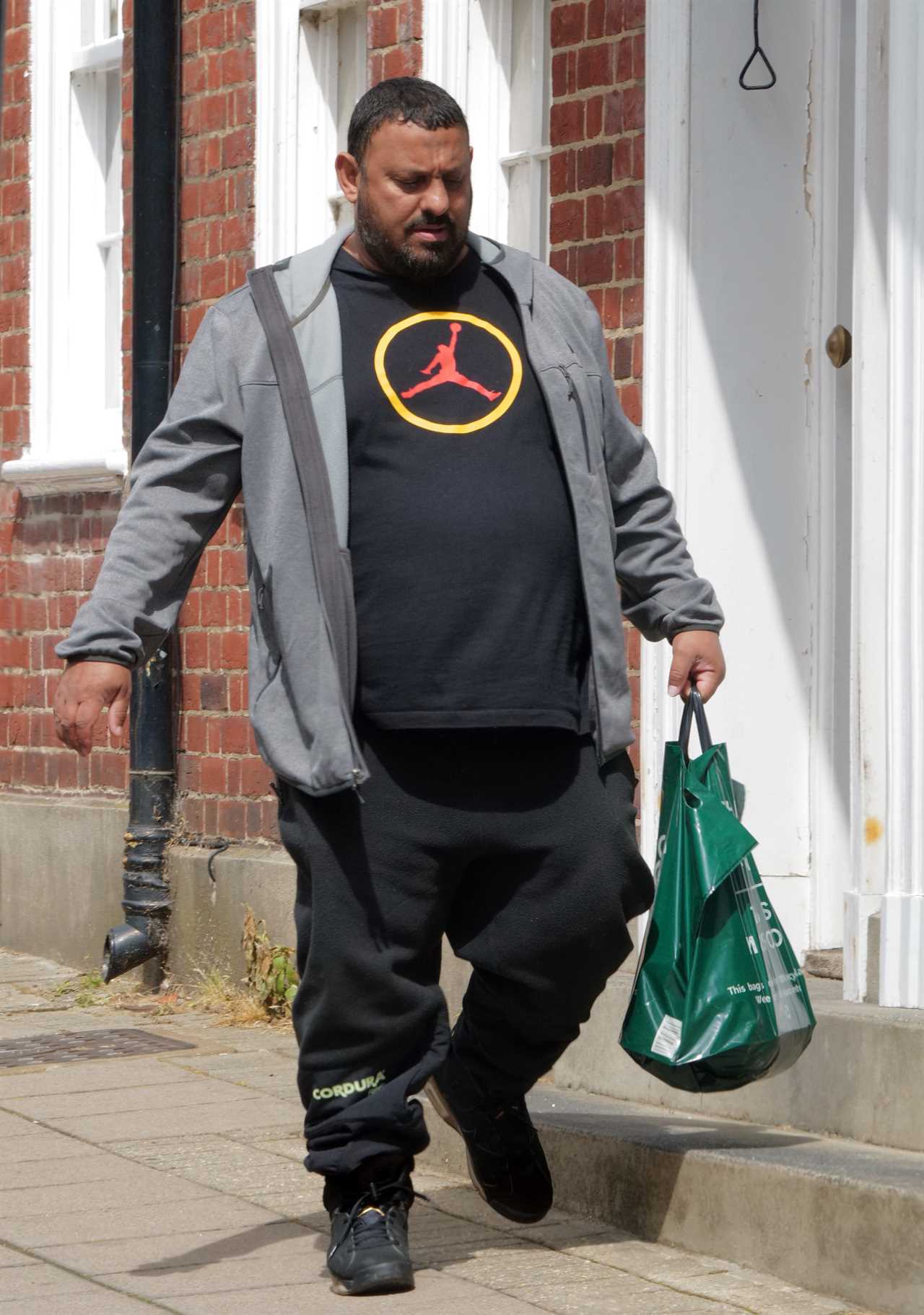 Prince Naseem Hamed, who rents a PS1.4m house near the Queen, is pictured strolling around Windsor Castle