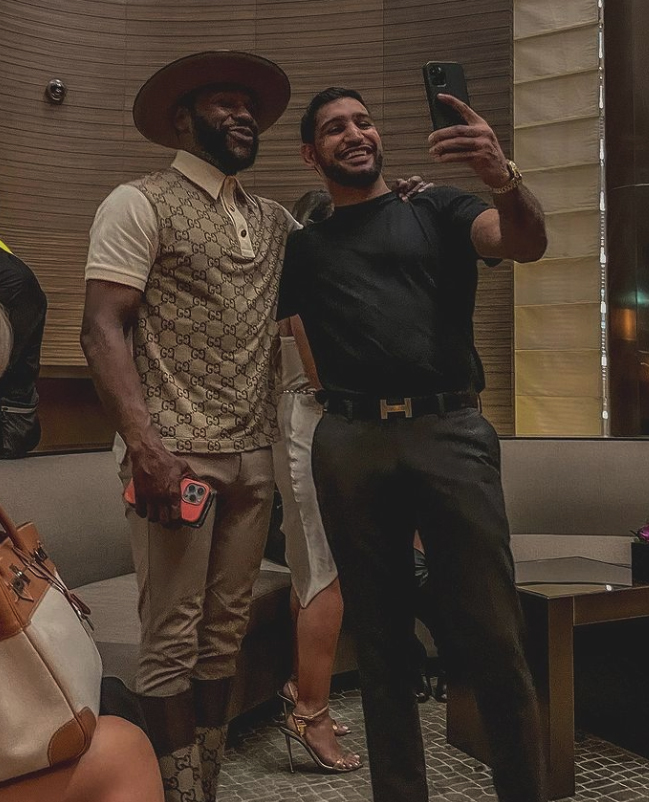 Floyd Mayeather's luxurious Dubai trip, which includes yacht parties and indoor snowboarding, is featured in this article.