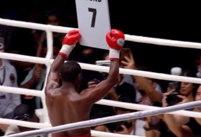 Watch Floyd Mayweather dance with his ring girl and carry around card in Abu Dhabi's exhibition.