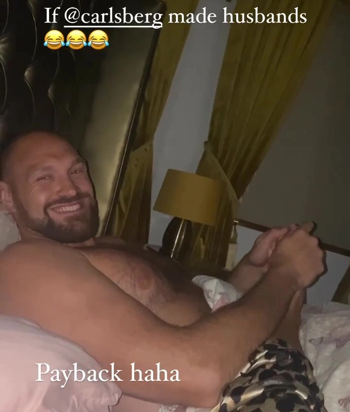 Tyson Fury, 'Lord Of The Ring', is dressed in a suit and boots as he poses beside a luxury jeep while he enjoys retirement