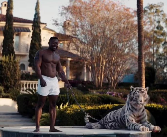 Spine-tingling trailer for Mike Tyson biopic this summer shows famous Evander Holyfield ear bite and pet tiger