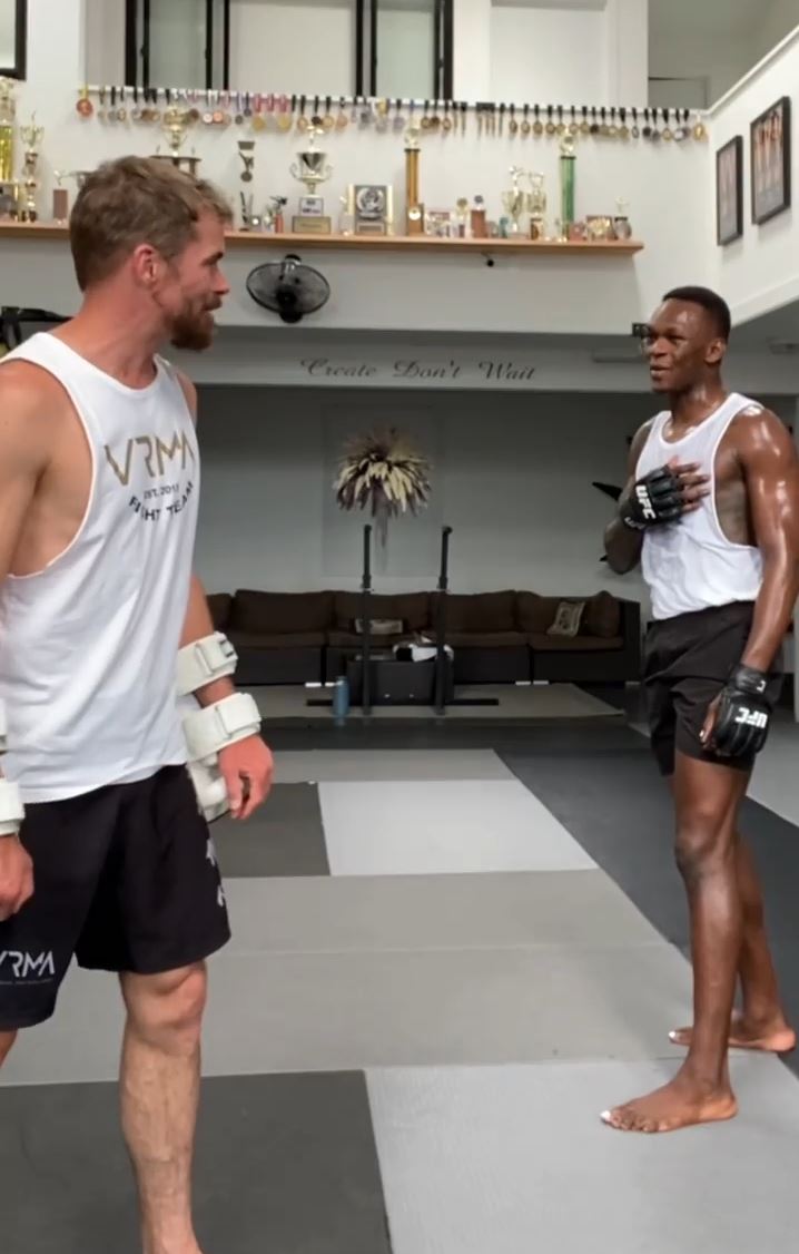 Watch as Israel Adesanya nearly knocks out his COACH by using dangerous wheel kicks in training for UFC 276.