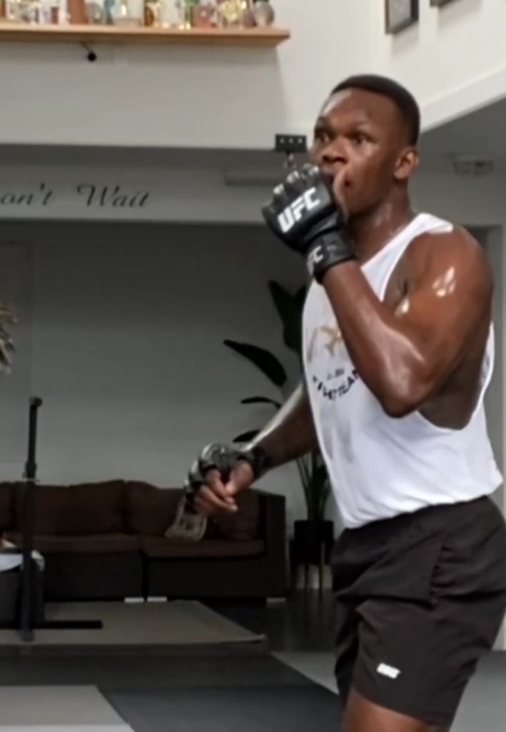 Watch as Israel Adesanya nearly knocks out his COACH by using dangerous wheel kicks in training for UFC 276.