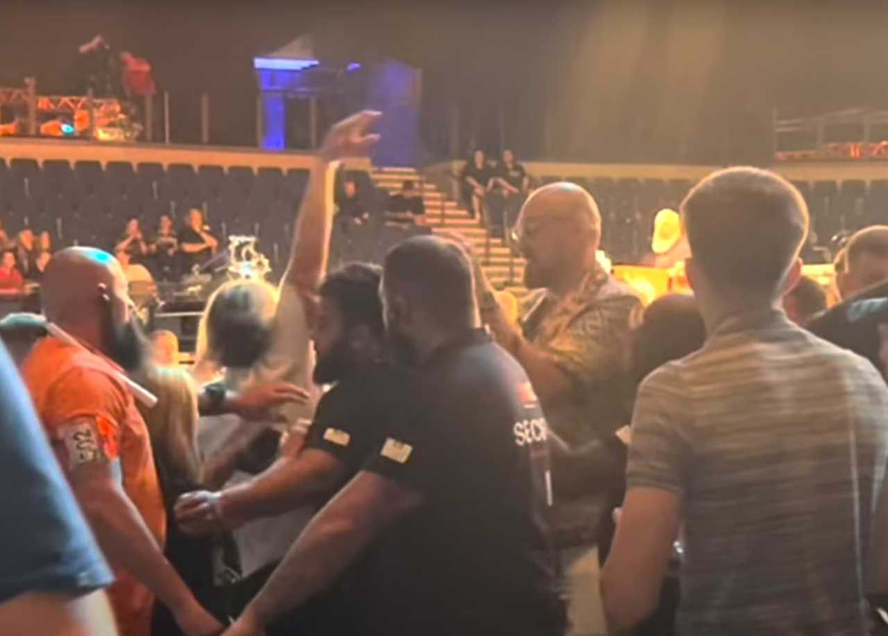 Tyson Fury is forced to shoo off a fan who attempted to take a selfie with the heavyweight boxing champ